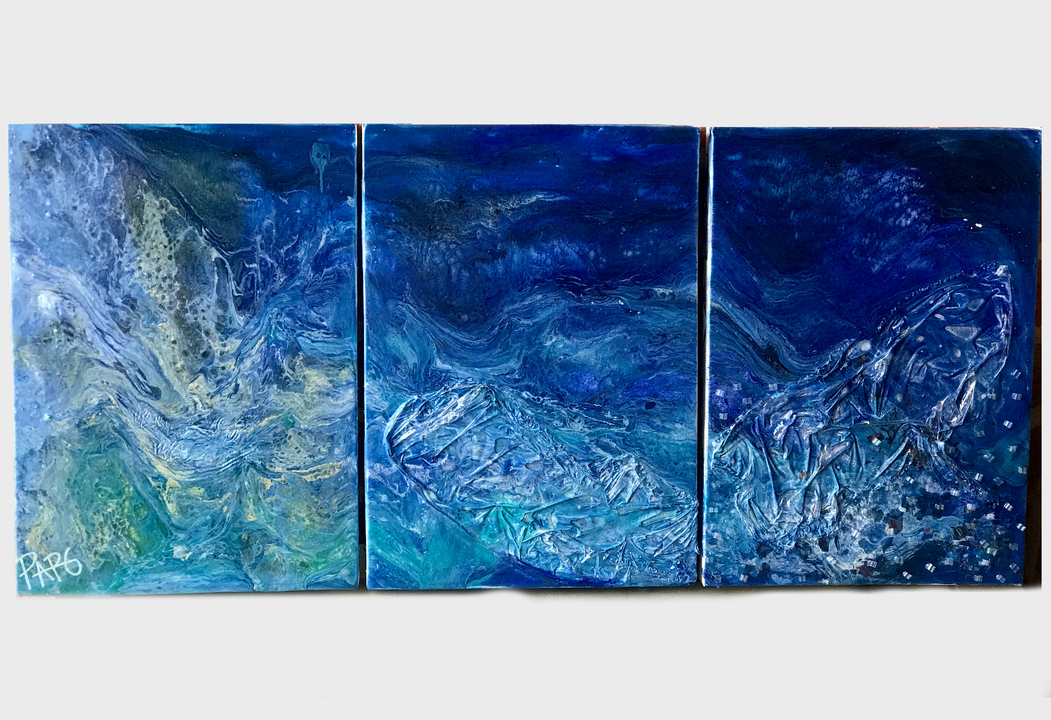 Triptych painting with textured blue abstract patterns resembling water or waves.